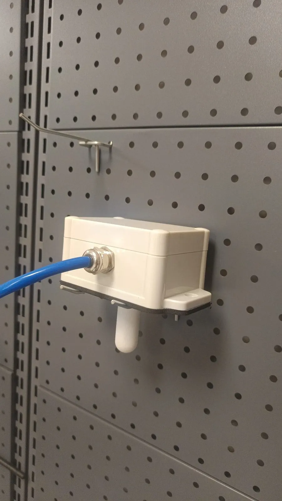 SiloSense sensor head and cable mounted on a wall